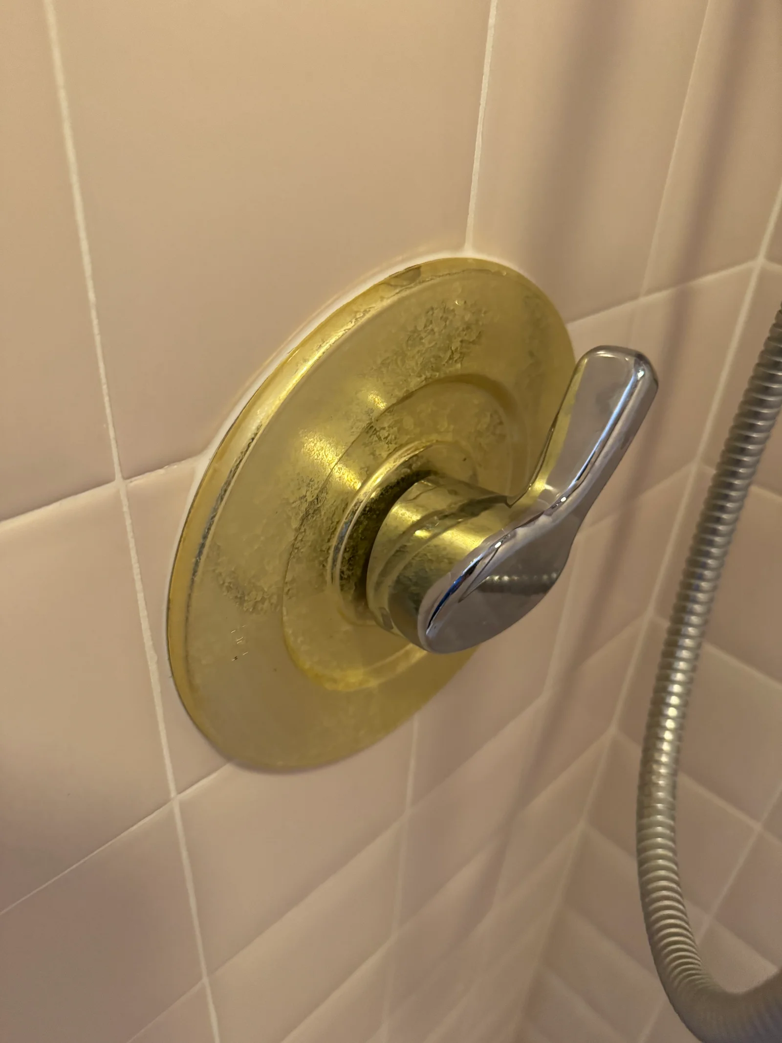 Mineral-encrusted plumbing valve showing severe hard water calcium buildup in a Northern Utah home