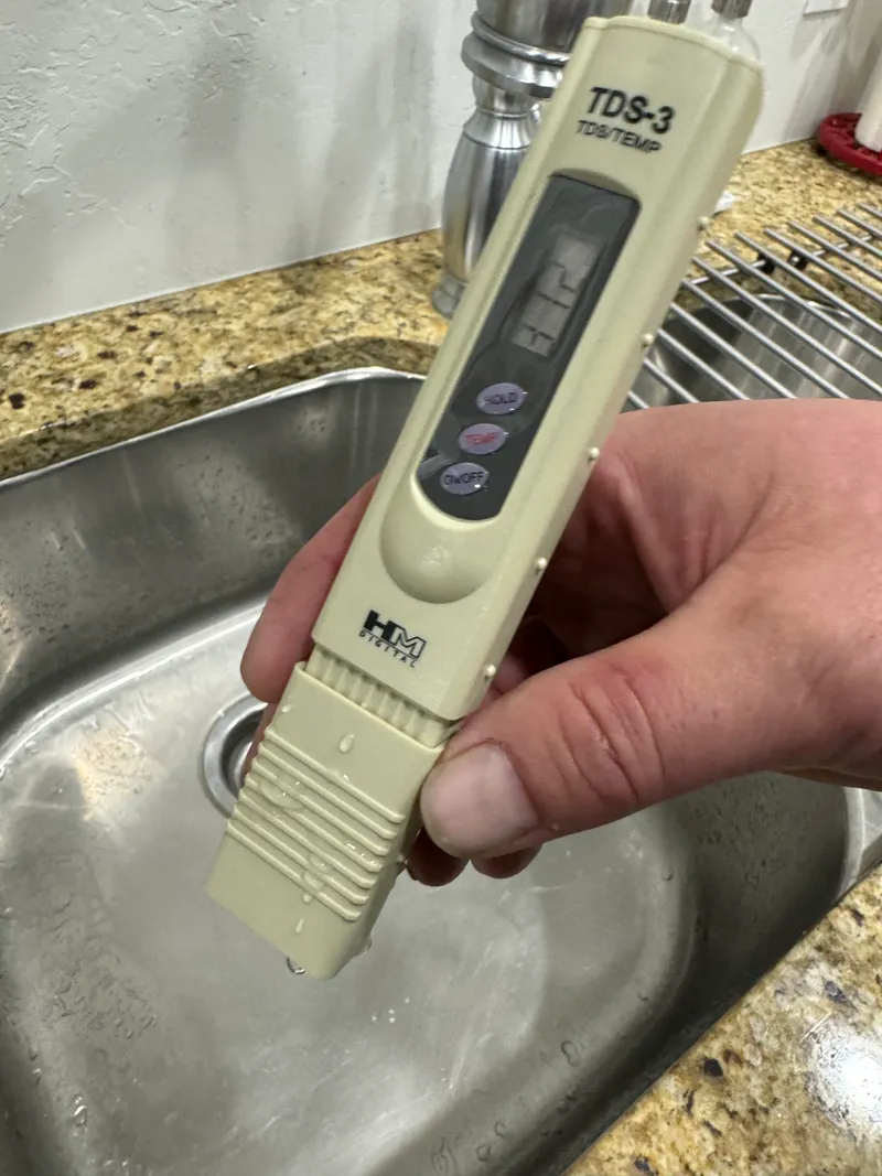 Professional water quality testing with TDS meter