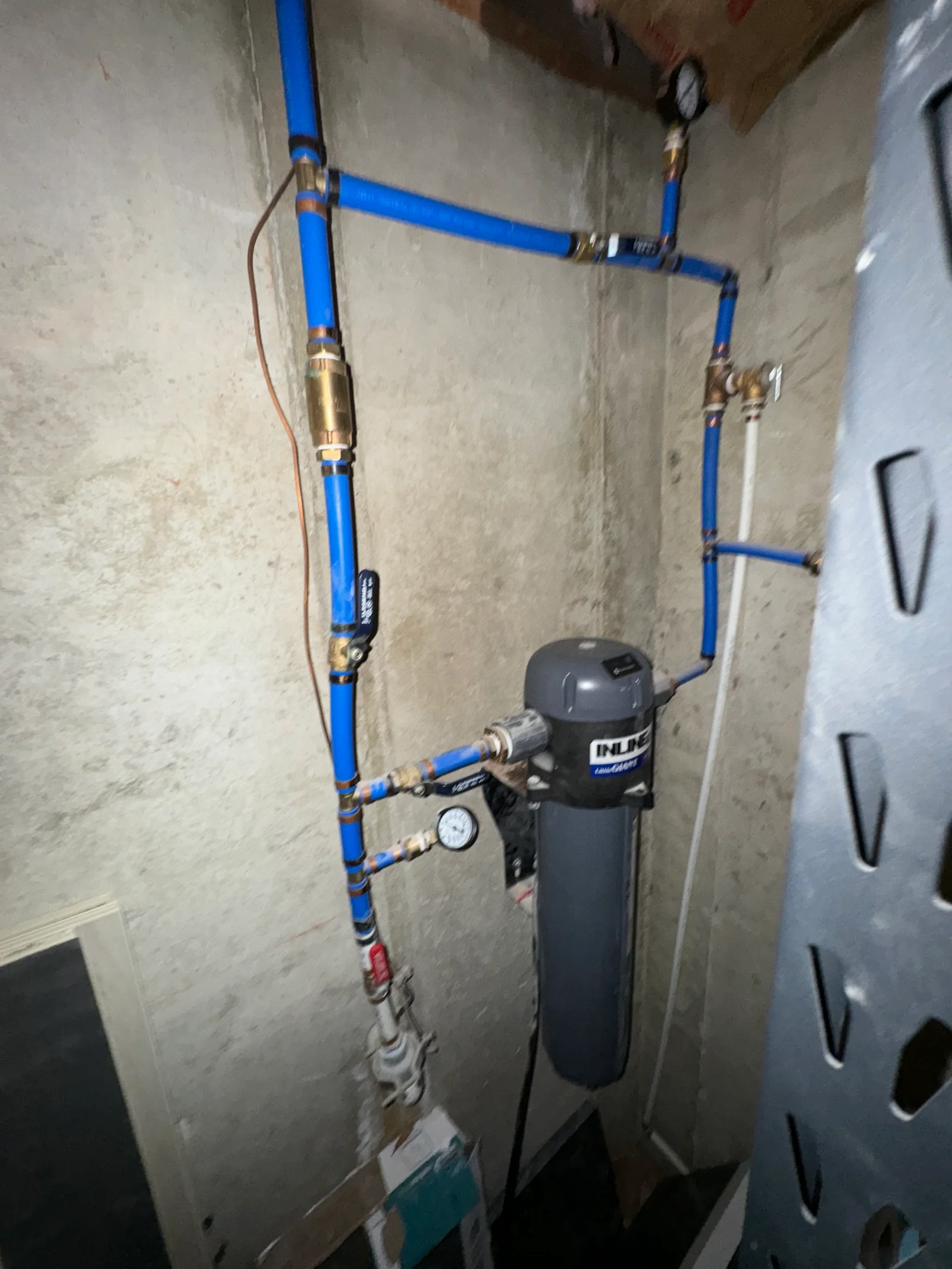 Professional water filtration system with PEX piping installed for a Utah home's water supply