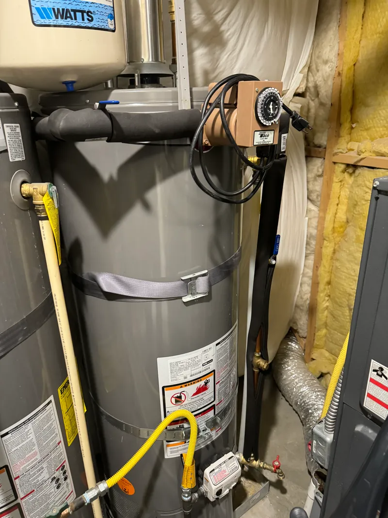 Utility area installation in a Northern Utah home showing basement mechanical room context